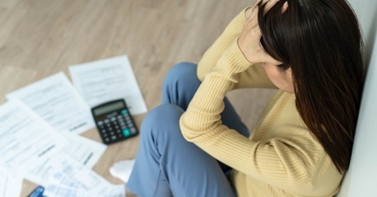 woman looking at bills