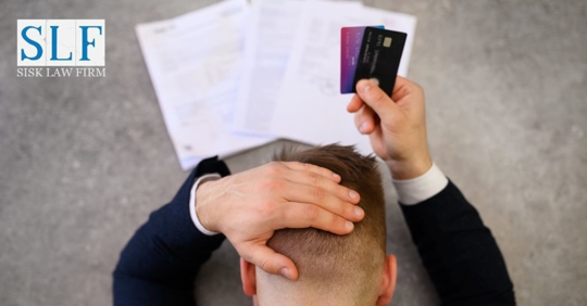 man holding credit cards